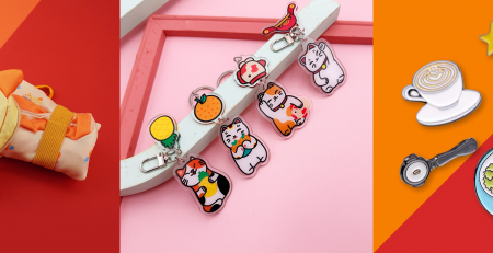 Vivopress mascot products including a custom tote, acrylic keychains and pins